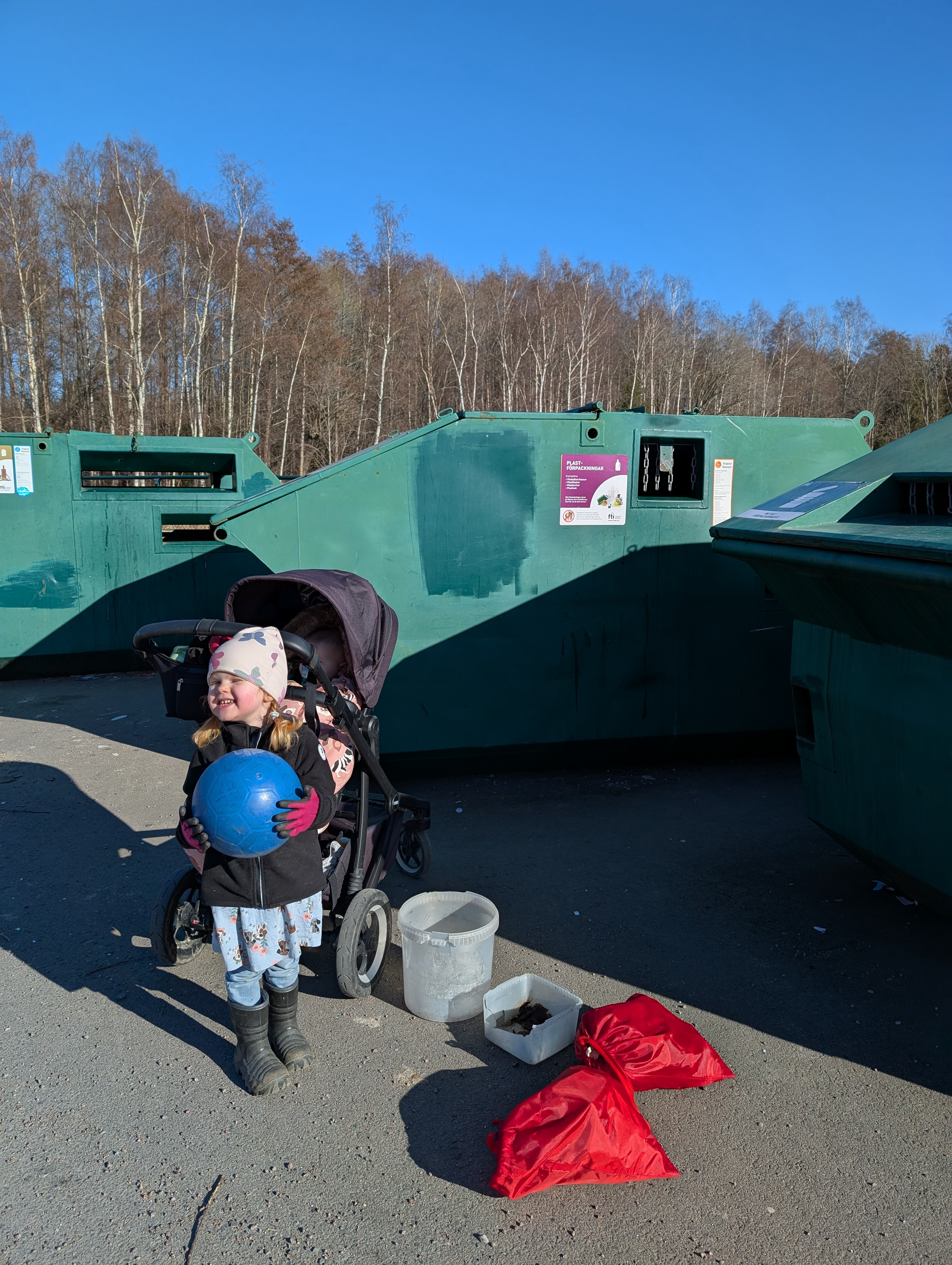 Two bags of trash and football